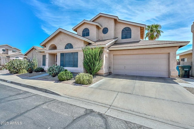 18807 N 42nd Ave, Glendale, AZ 85308 - view of front of house with an attached garage, stucco siding, and concrete driveway