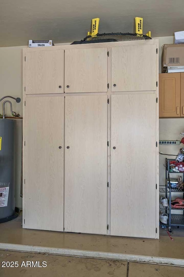 18807 N 42nd Ave, Glendale, AZ 85308 - miscellaneous room featuring concrete flooring and electric water heater