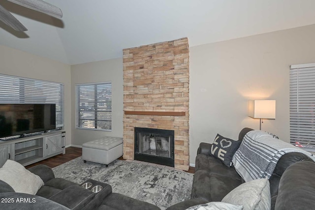 18807 N 42nd Ave, Glendale, AZ 85308 - living area with wood finished floors, a stone fireplace, baseboards, a ceiling fan, and vaulted ceiling