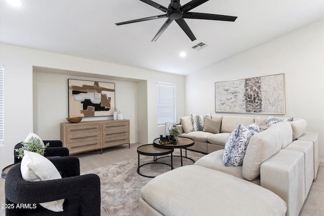 living room featuring light carpet, vaulted ceiling, and ceiling fan