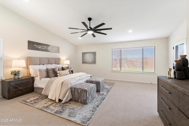 carpeted bedroom with vaulted ceiling and ceiling fan