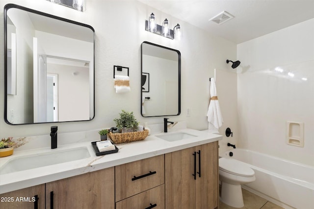 full bathroom featuring vanity, tile patterned flooring, toilet, and shower / bath combination