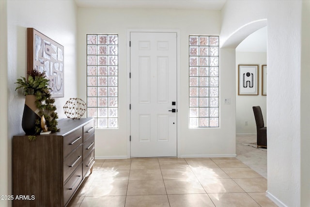 foyer entrance with light tile patterned flooring