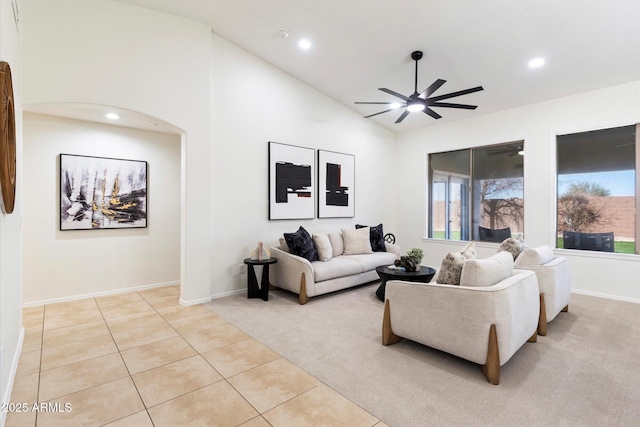 tiled living room featuring vaulted ceiling and ceiling fan