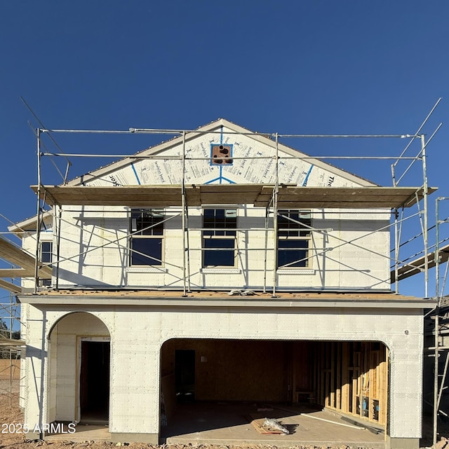 unfinished property featuring a garage