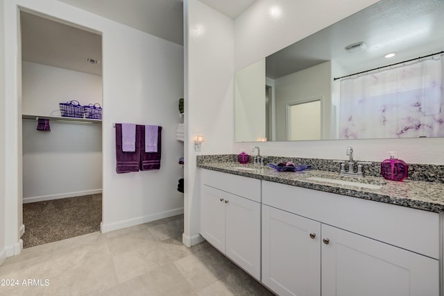 bathroom featuring tile patterned floors and vanity