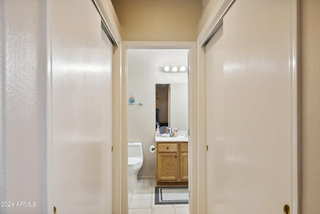 hall with light tile patterned flooring