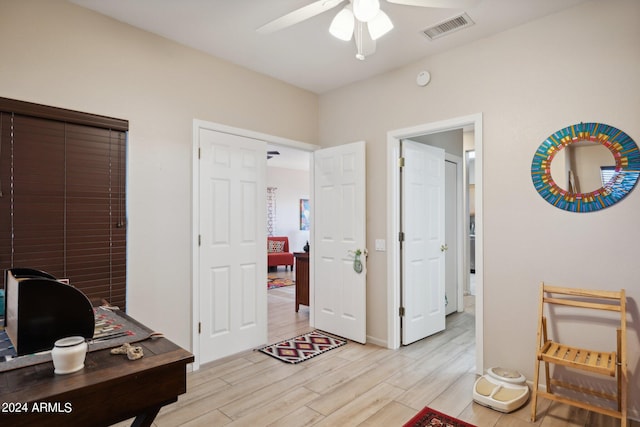 office area featuring ceiling fan and light wood-type flooring