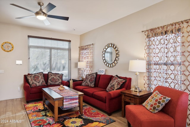 living room with ceiling fan and hardwood / wood-style flooring