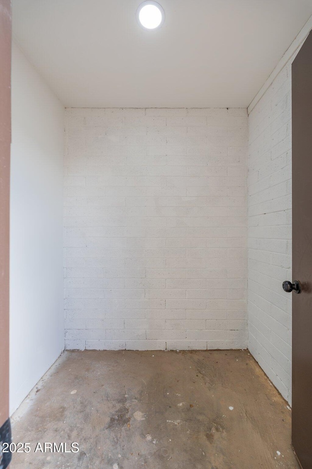 interior space featuring unfinished concrete floors