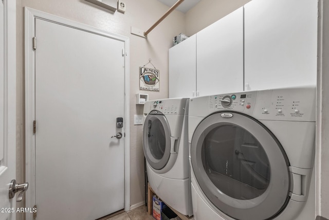 laundry area with washer and dryer and cabinet space