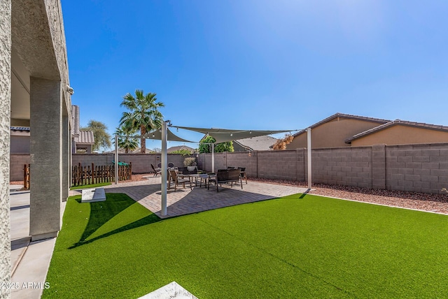 view of yard with a patio and a fenced backyard