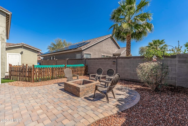 view of patio / terrace featuring a fenced backyard and an outdoor fire pit