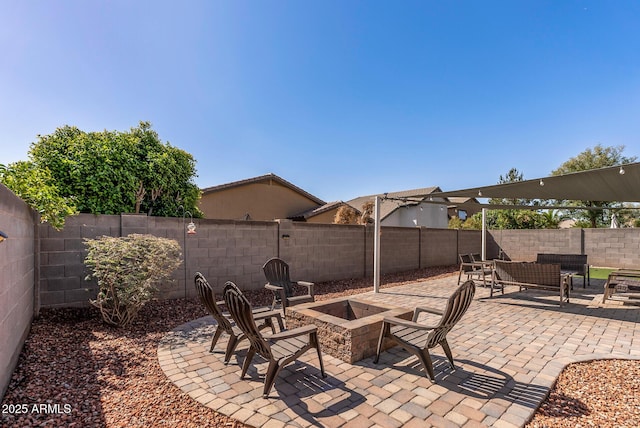 view of patio / terrace featuring a fire pit and a fenced backyard