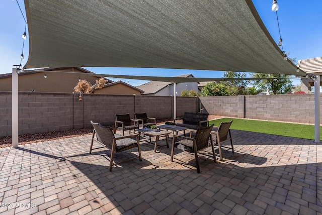 view of patio with an outdoor hangout area and a fenced backyard