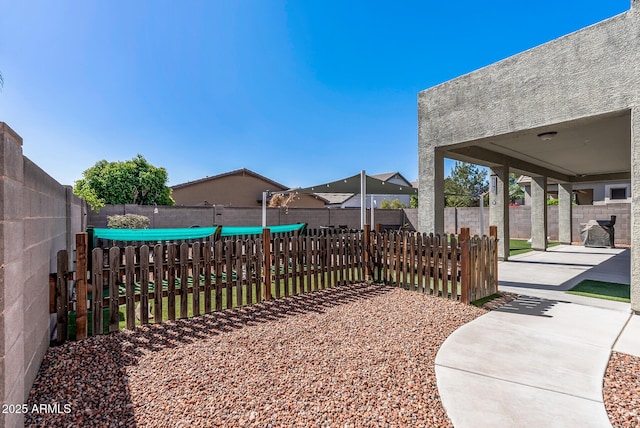 view of yard featuring a patio and a fenced backyard