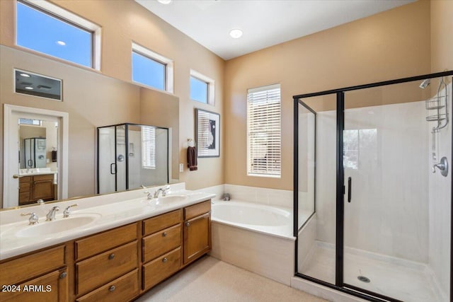 bathroom featuring independent shower and bath and vanity