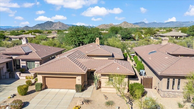 birds eye view of property featuring a mountain view