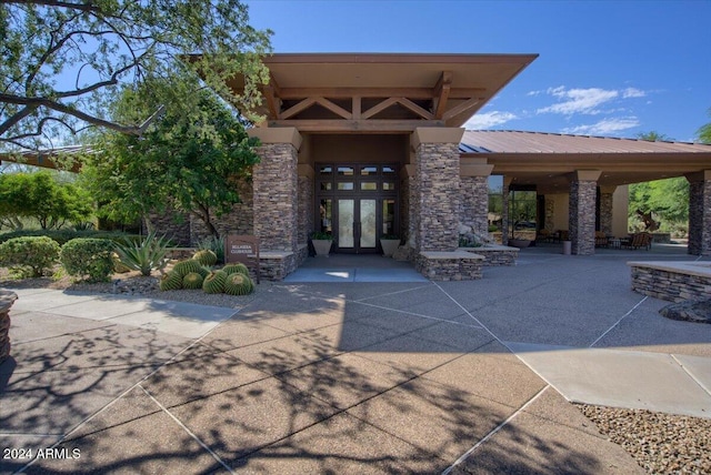 doorway to property featuring a patio and french doors