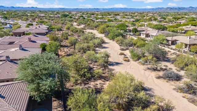 birds eye view of property featuring a mountain view