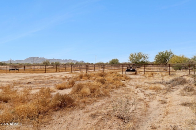 view of yard featuring a mountain view and a rural view