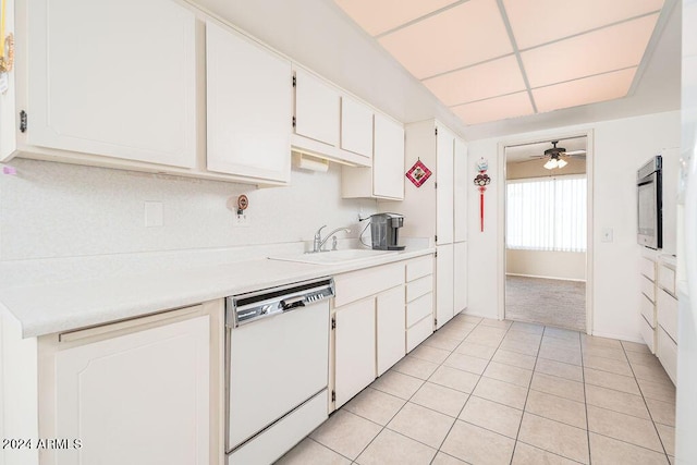 kitchen with ceiling fan, dishwasher, white cabinets, and light tile patterned flooring