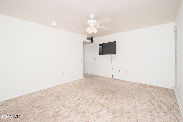 empty room featuring carpet floors and ceiling fan