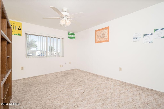 unfurnished room featuring ceiling fan and carpet floors