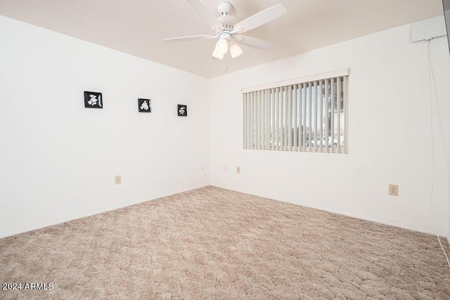 carpeted empty room with ceiling fan