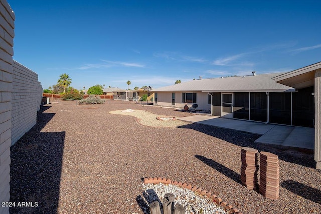 view of yard with a patio and a sunroom