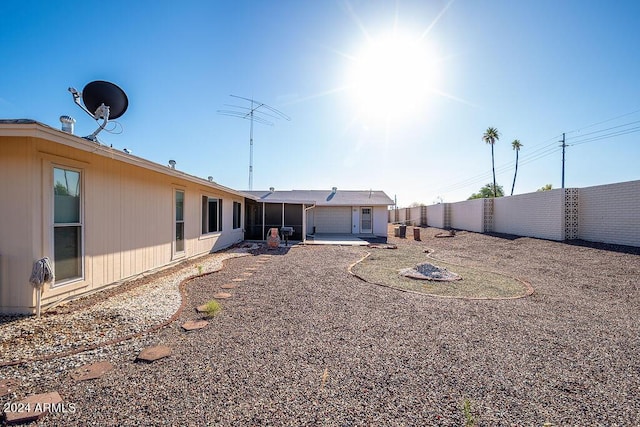 back of property featuring a patio area