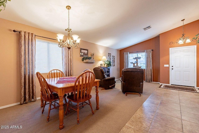 dining space featuring visible vents, light colored carpet, vaulted ceiling, light tile patterned floors, and a notable chandelier