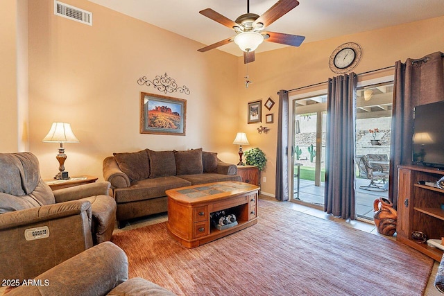 living area with visible vents and a ceiling fan