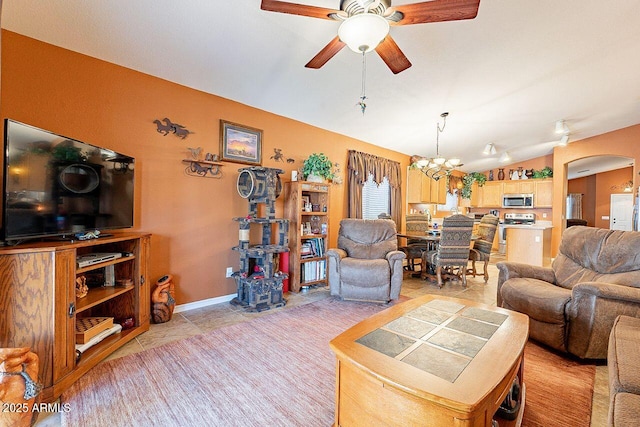 living area featuring lofted ceiling, ceiling fan with notable chandelier, arched walkways, light tile patterned flooring, and baseboards