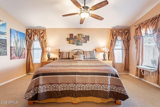 carpeted bedroom featuring ceiling fan and baseboards