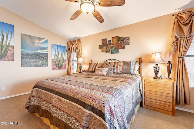 bedroom with light carpet, ceiling fan, baseboards, and lofted ceiling