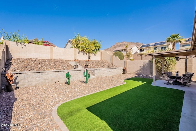 view of yard with a fenced backyard and a patio