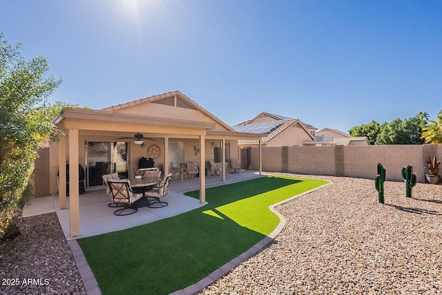 exterior space featuring ceiling fan, a patio, and a fenced backyard