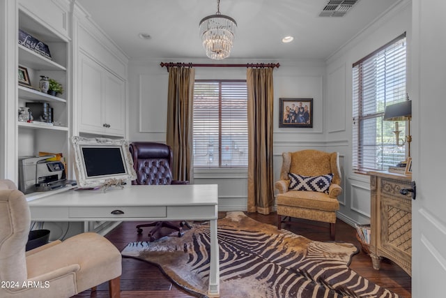 office with ornamental molding, an inviting chandelier, and dark hardwood / wood-style flooring