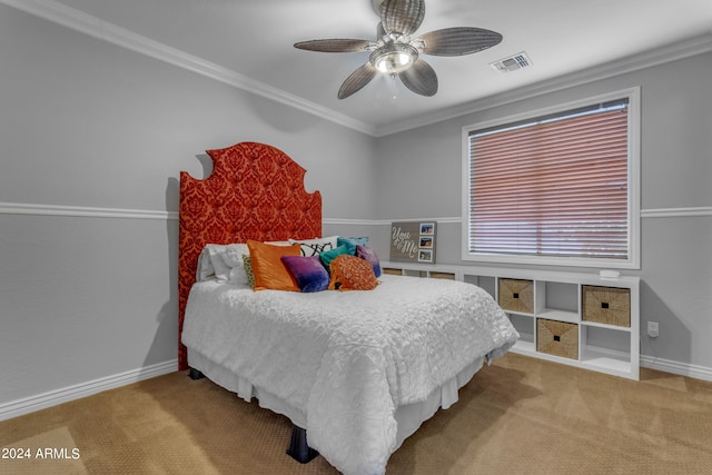 bedroom featuring ornamental molding, light carpet, and ceiling fan