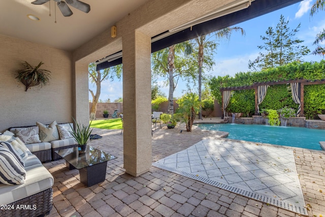 view of patio / terrace with ceiling fan, an outdoor living space, and pool water feature