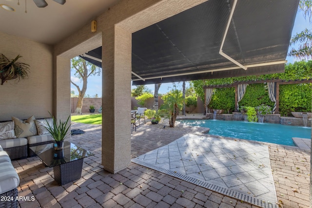 view of swimming pool featuring an outdoor living space, a patio area, and pool water feature