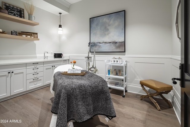 dining area featuring light wood-type flooring and sink