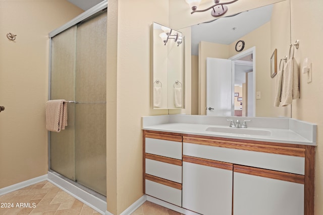 bathroom with vanity and an enclosed shower