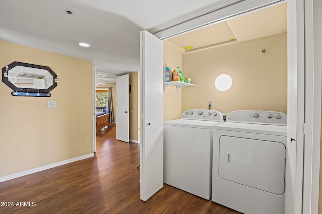 washroom with independent washer and dryer and dark wood-type flooring