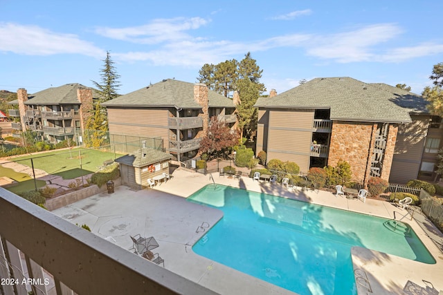 view of swimming pool featuring a patio area