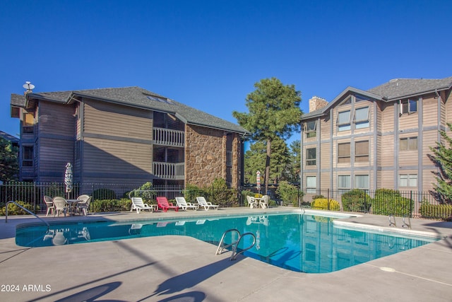 view of swimming pool with a patio area