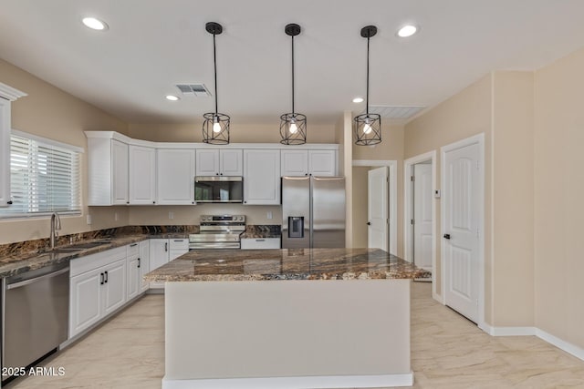 14646 S Brook Hollow Rd, Arizona City, AZ 85123 - kitchen with a sink, marble finish floor, visible vents, a center island, and appliances with stainless steel finishes