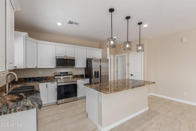 14646 S Brook Hollow Rd, Arizona City, AZ 85123 - kitchen with a sink, stainless steel appliances, visible vents, and white cabinets