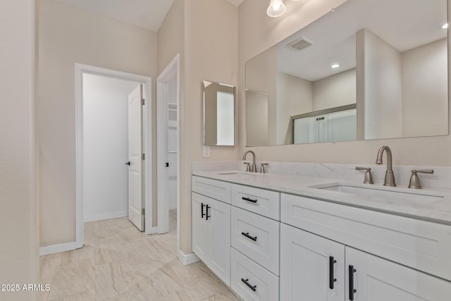 14646 S Brook Hollow Rd, Arizona City, AZ 85123 - full bath featuring marble finish floor, visible vents, a sink, and double vanity
